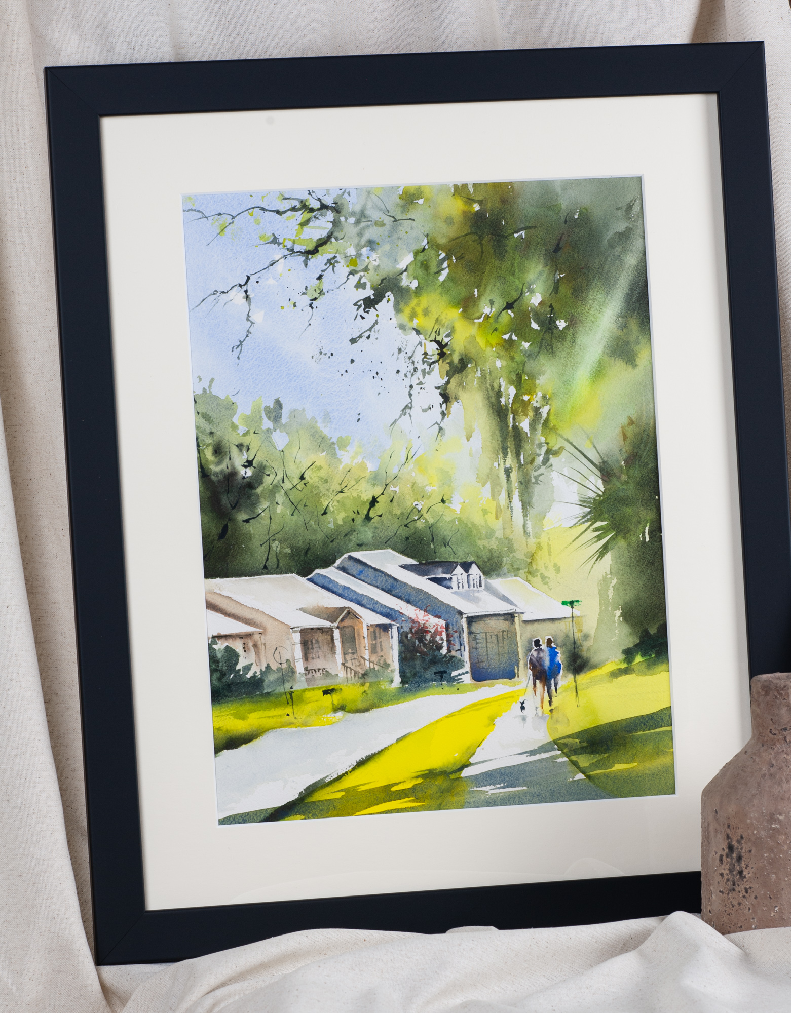 Around the Block Charleston neighborhood artwork displayed in a black frame, inviting home décor
