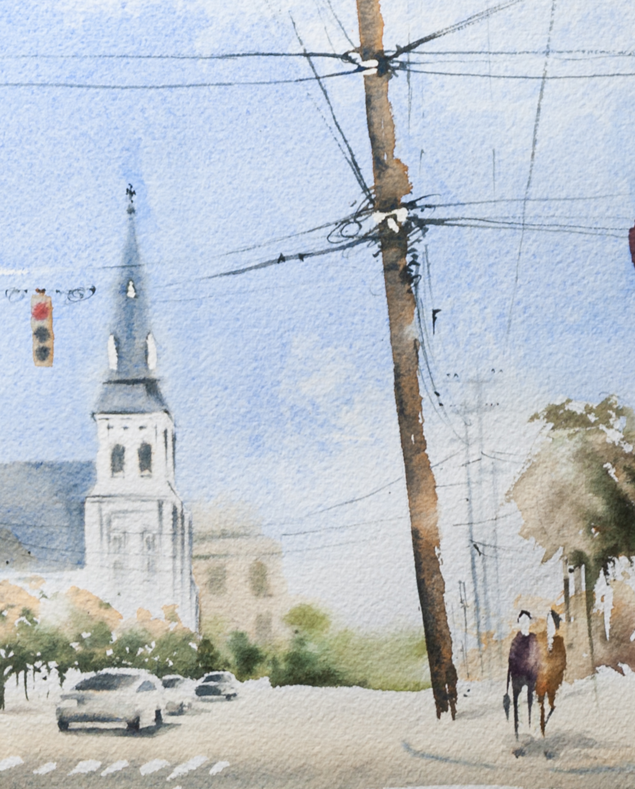 Close-up detail of Charleston Meeting Street artwork with church steeple and passing cars
