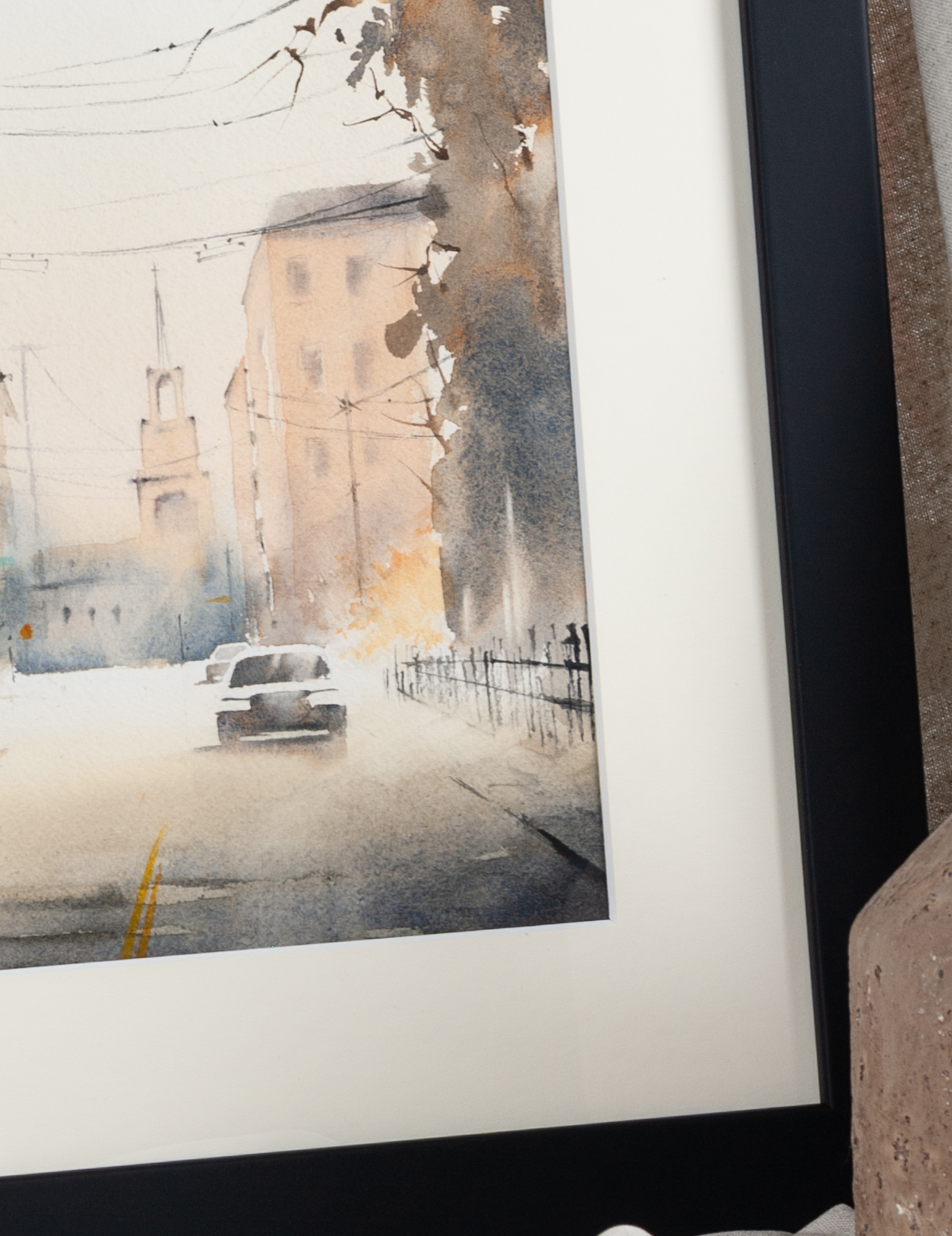 Close-up detail of Holy City Charleston artwork with historic street and passing car