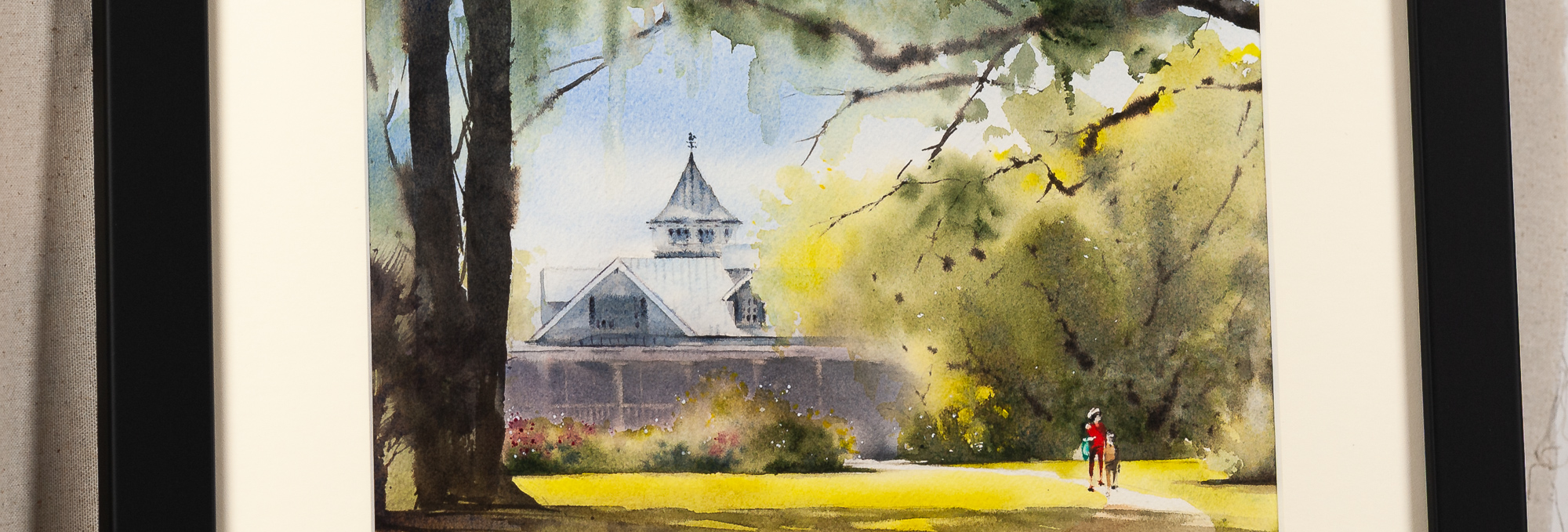 Close-up detail of Magnolia Plantation and Gardens watercolor painting, featuring the historic plantation home, sunlit lawn, flowering gardens, and two figures walking beneath live oak trees in Charleston, South Carolina.