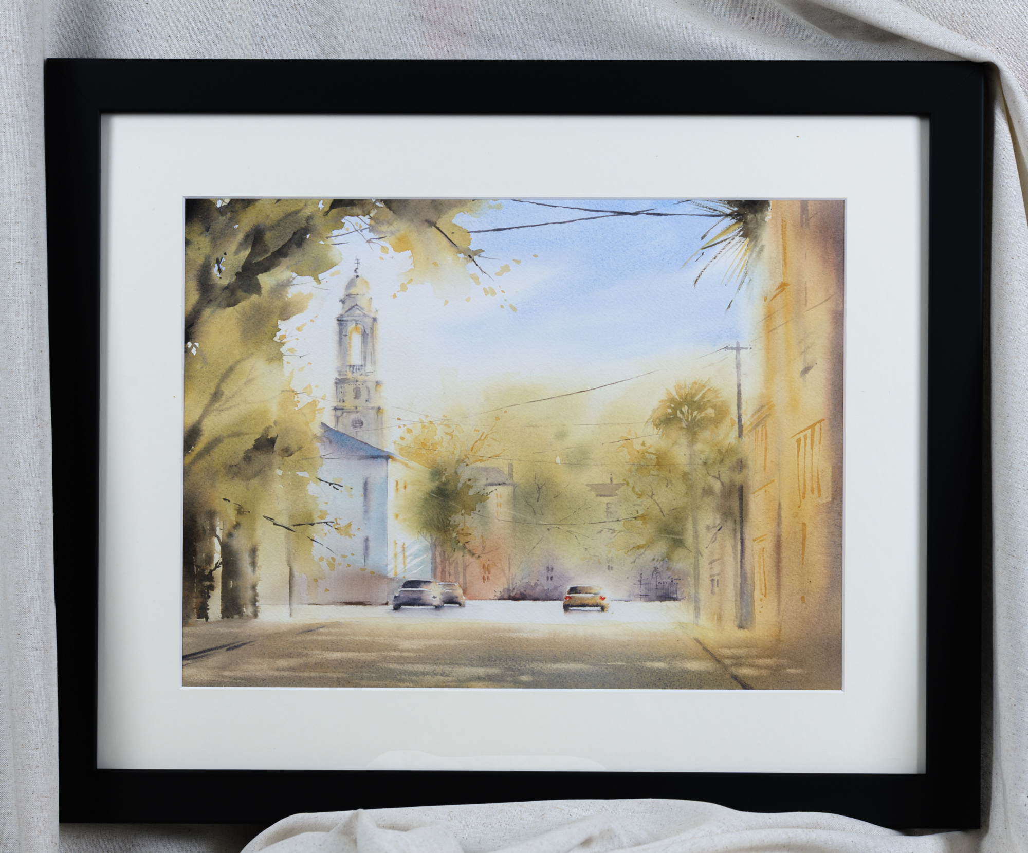 Framed St. John’s Lutheran Church Charleston watercolor painting with white mat and black frame