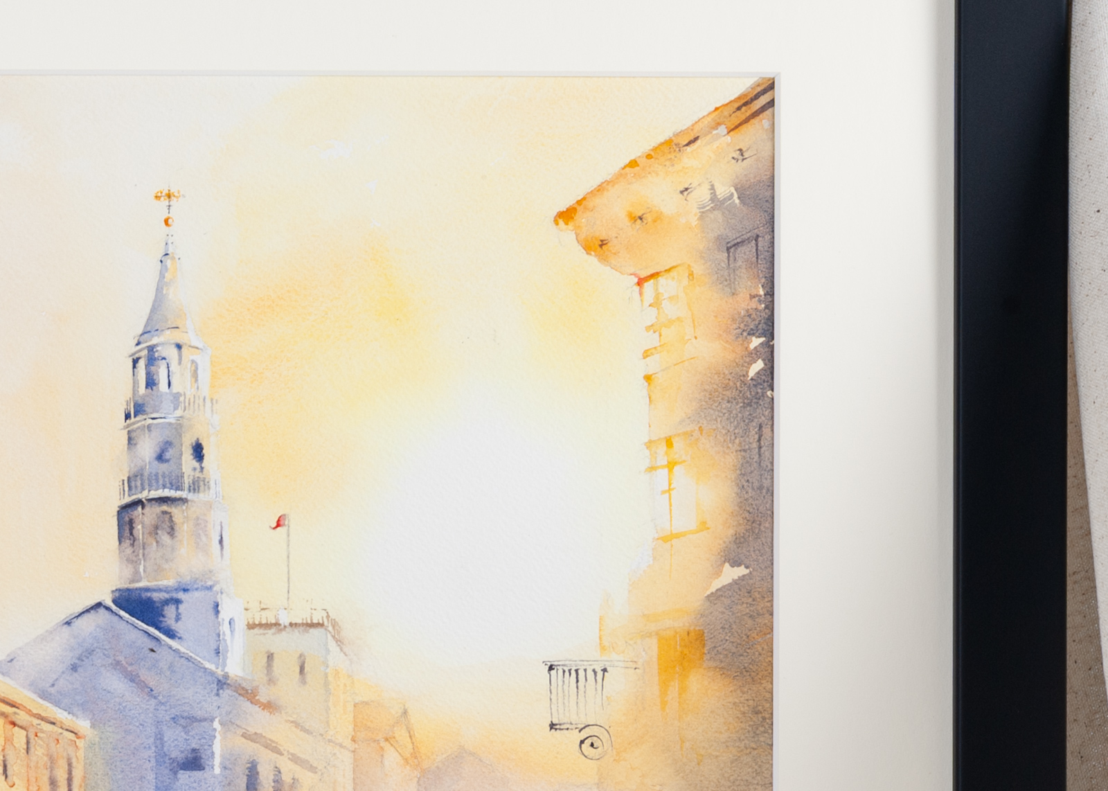 Close-up detail of Charleston St. Michael’s Church artwork with steeple against golden sunset sky
